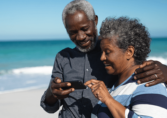 Man and Woman Looking at Phone